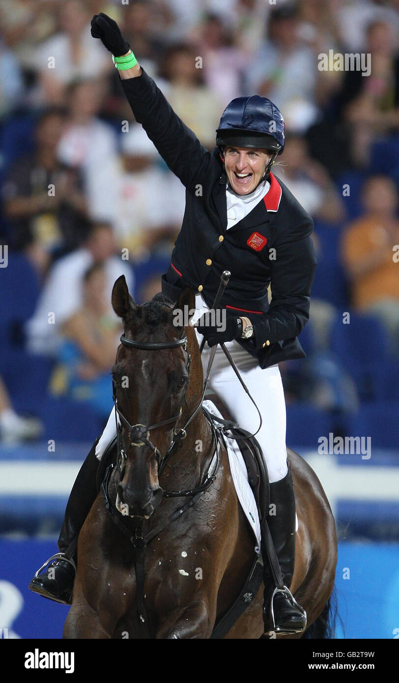 Great Britain's Tina Cook on Miners Frolic punches the air after completing her round during the individual show jumping final at the Shatin Equestrian centre, Hong Kong, during the 2008 Beijing Olympic Games in China. Stock Photo