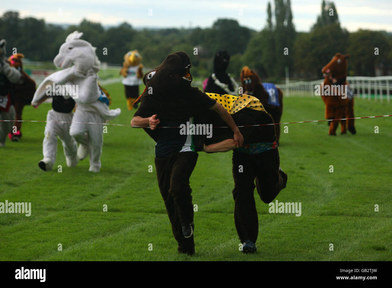 Horse Racing - Comedy Night - Sandown Park. Fancy dress horse racing Stock Photo