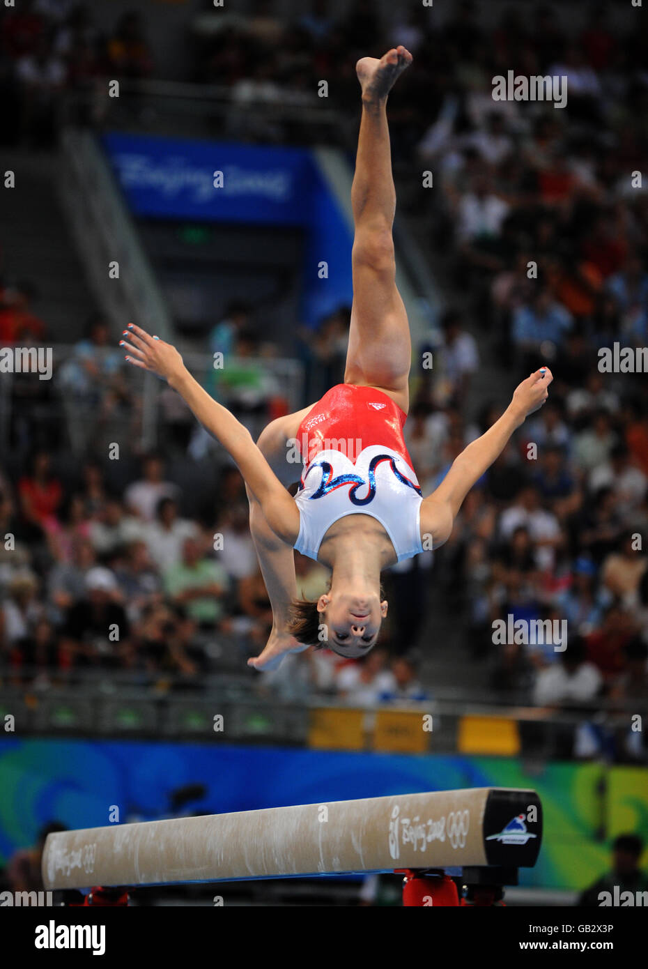 France's Laetitia Dugain in action on the beam in the Women's Individual All Round Final at Beijing's National Indoor Stadium. Stock Photo