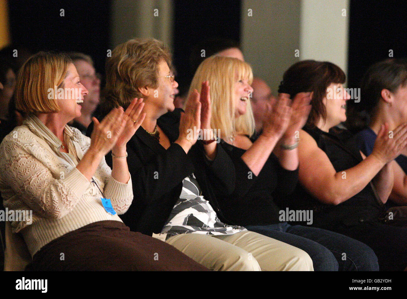 Racegoers are entertained by comedians in the Esher Hall at Sandown Park Stock Photo