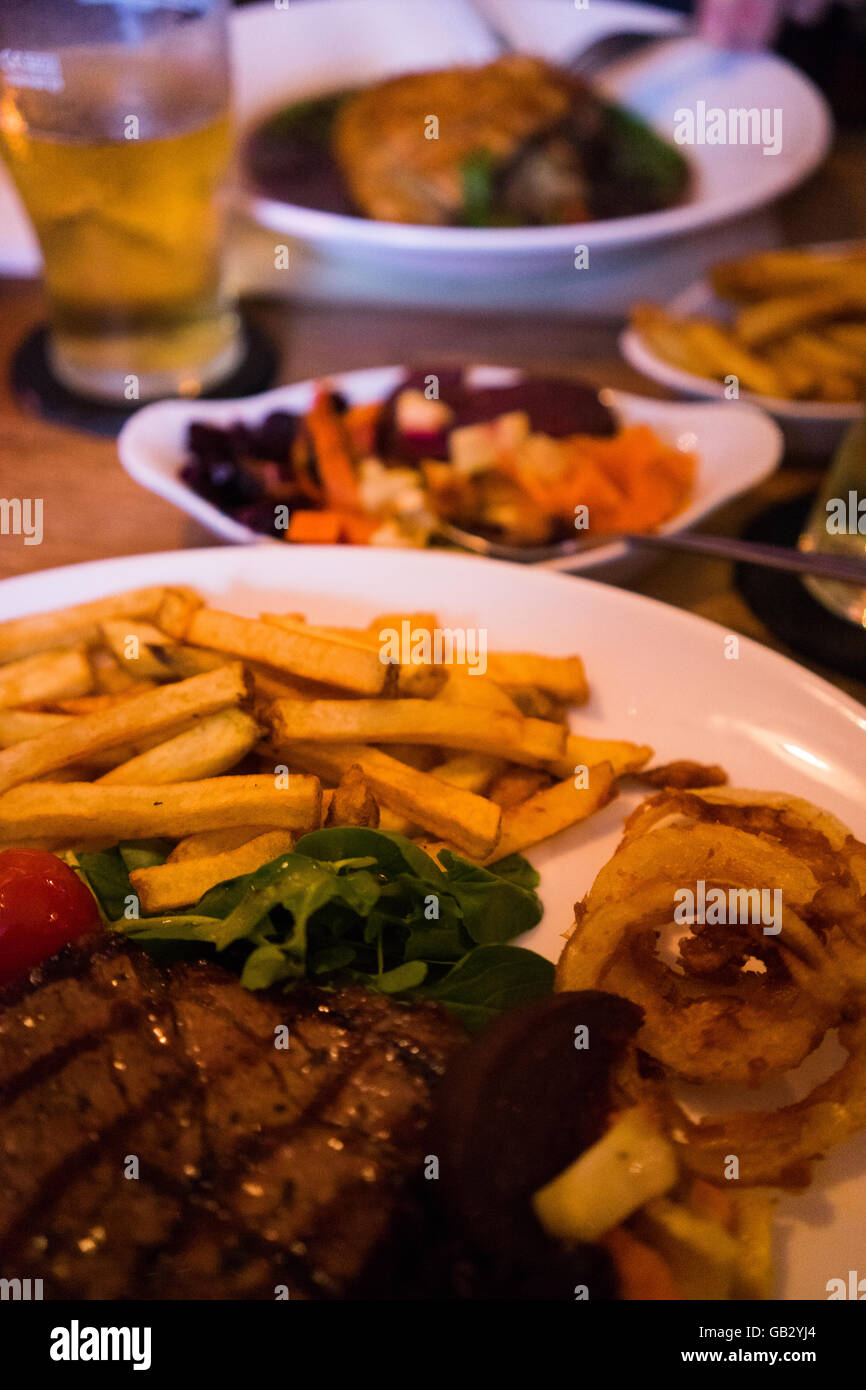 Steak and chips with cider meal pub eating traditional lunch Stock Photo