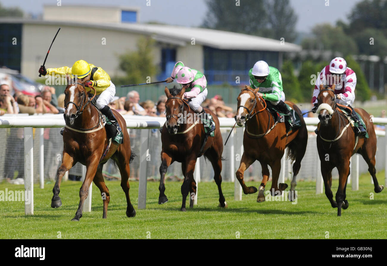 Shaweel ridden by Greg Fairley (left) wins The Irish Thoroughbred Marketing Gimcrack Stakes from Master Noverre ridden by Paul Hanagan (third left) at Newbury Racecourse. Stock Photo
