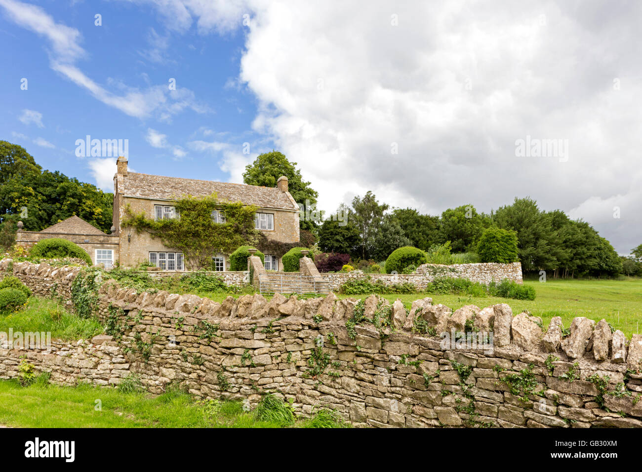 Attractive houses in the Cotswold village of Winstone, Gloucestershire, England, UK Stock Photo
