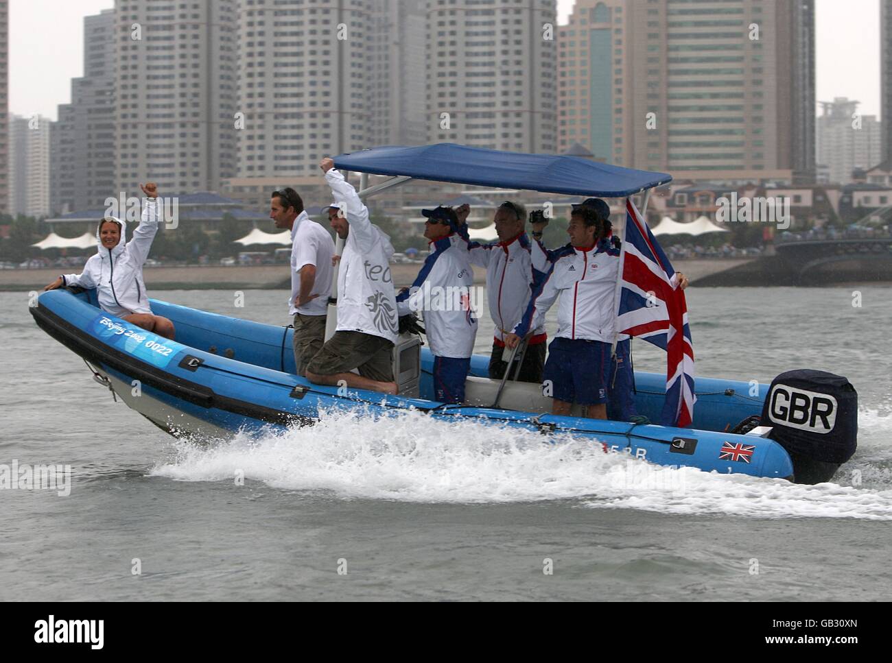 Great Britain's RIB launch boat celebrate Iain Percy and Andrew Simpson's Gold Medal winning performance after the final race of the Men's Star class at the Qingdao Olympic Sailing Center on day 13 of the 2008 Olympic Games in Beijing. Stock Photo