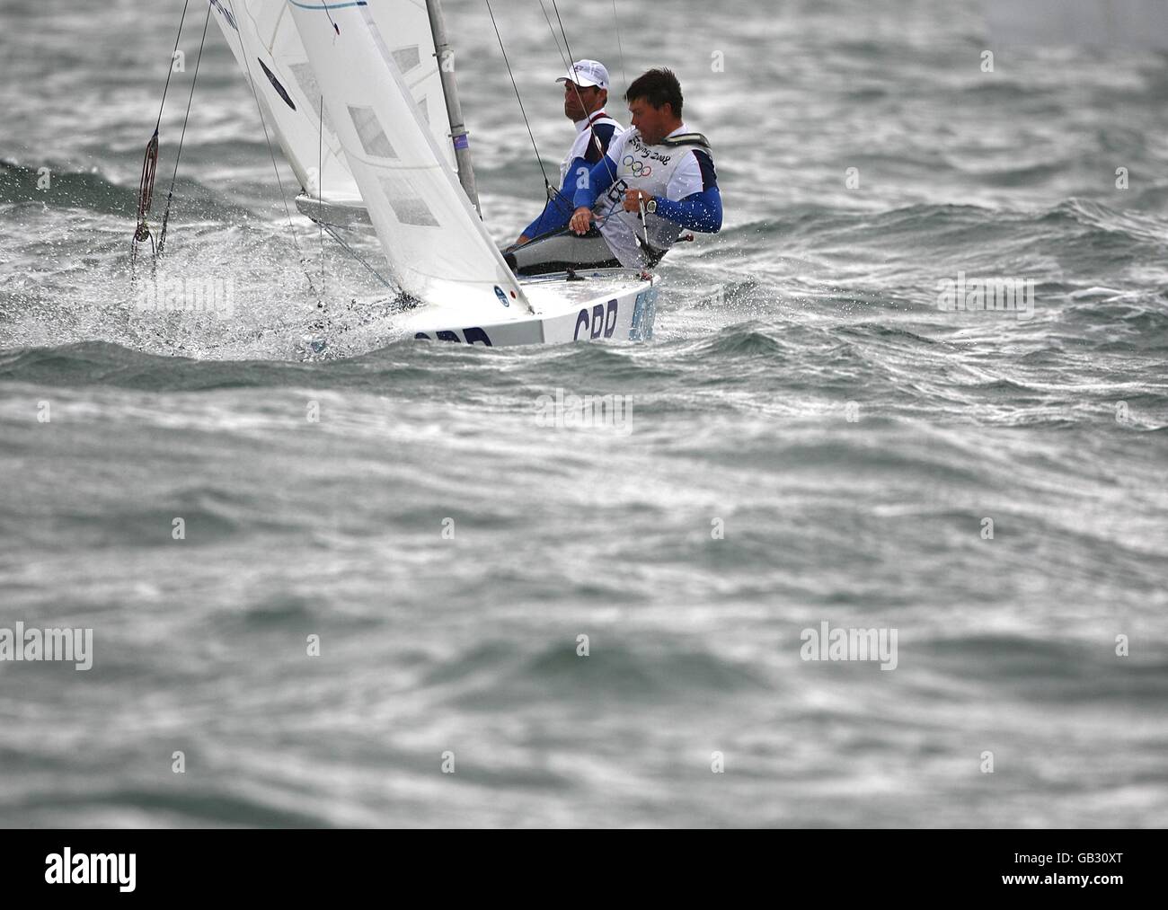 Great Britain's duo of Iain Percy and Andrew Simpson sail in the final race of the men's Star class at the Olympic Games' Sailing Centre in Qingdao on day 13 of the 2008 Olympic Games in Beijing. Stock Photo