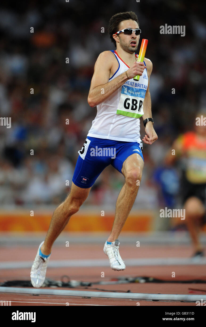Great Britain's Martyn Rooney in action in the Men's 4x400m relay heats at the National Stadium in Beijing during the 2008 Beijing Olympic Games in China. Stock Photo