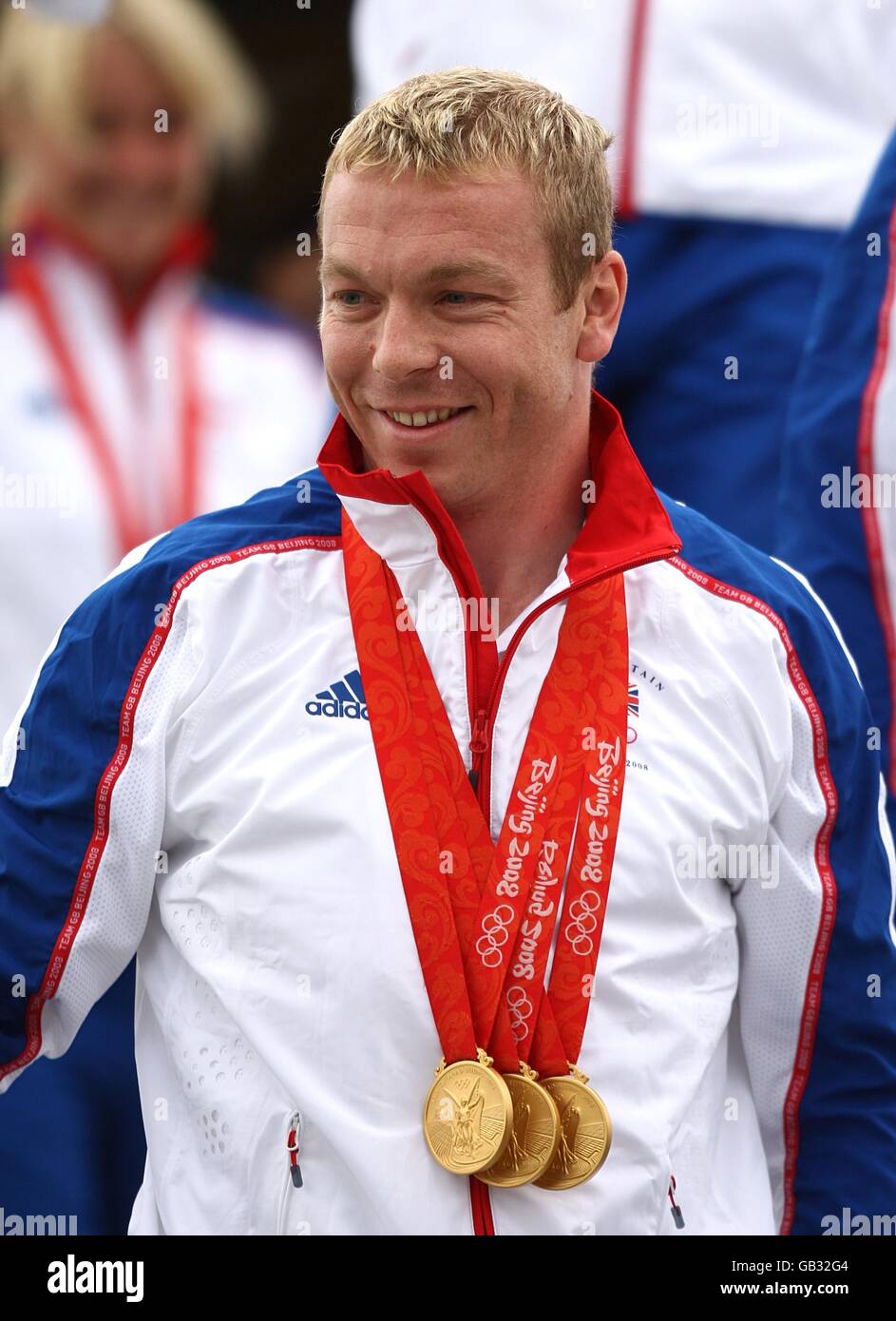 triple gold medal winner Chris Hoy leaves the plane carrying the Great