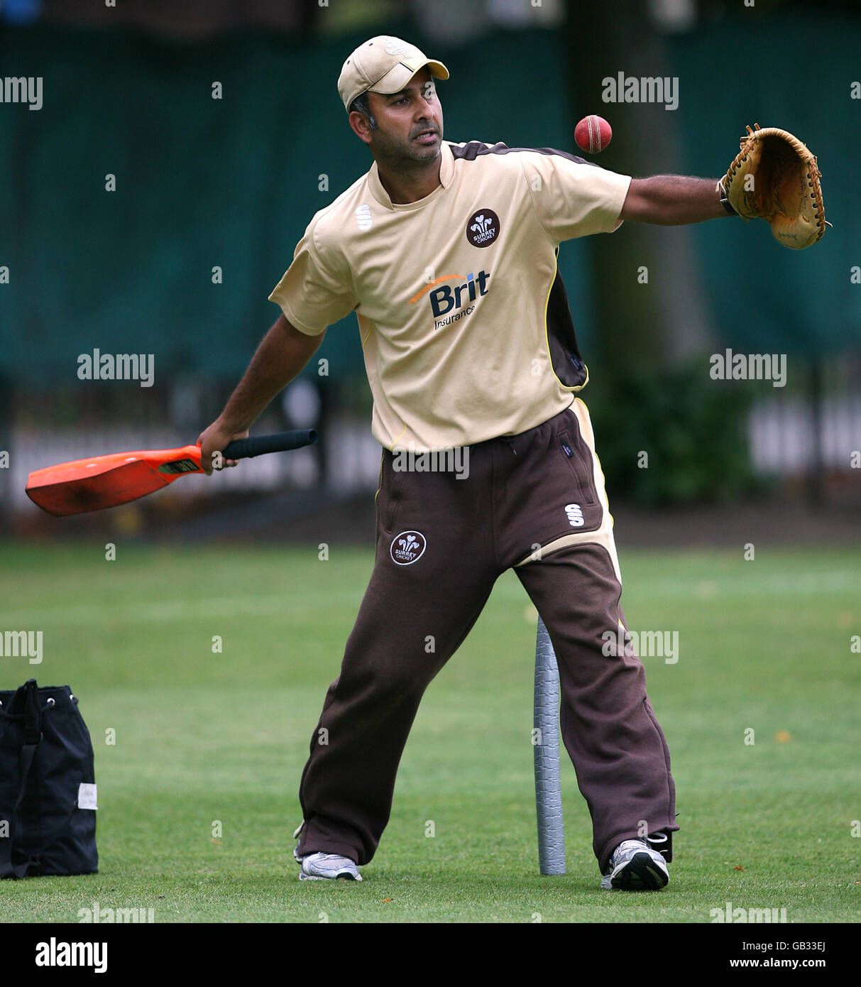 Surrey's second team coach Nadeem Shahid takes the players through their warm up Stock Photo