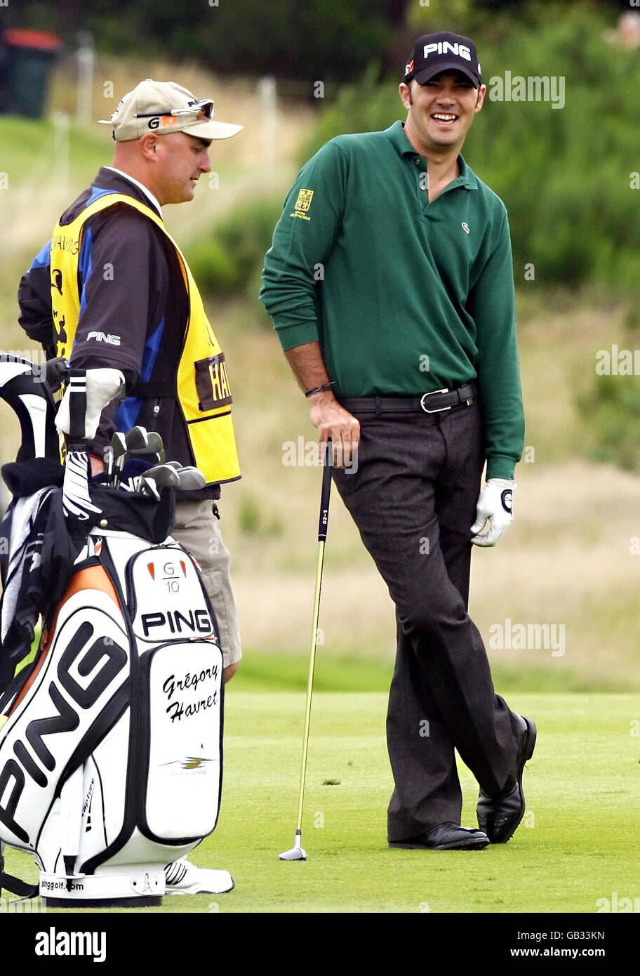 France s Gregory Havret on the 2nd tee enjoys a joke with his