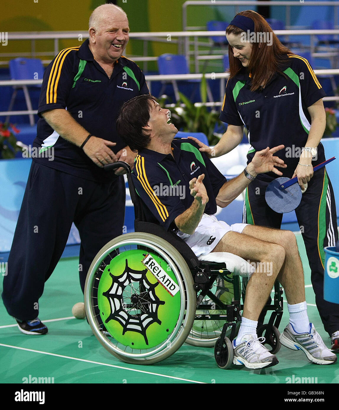 Gabriel Shelly competing in the Boccia event at the Fencing Hall of National Convention Center, celebrates a good shot with his coaches Patrick Judge and Brenda Hopkins in Beijing, China. Stock Photo