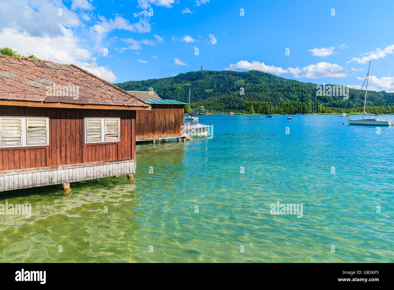 Wooden traditional boat house on shore of Worthersee lake in summer, Austria Stock Photo