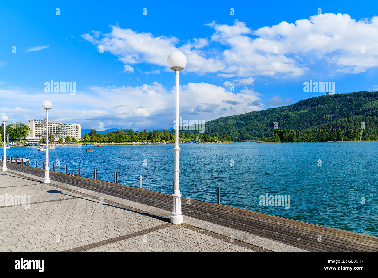 WORTHERSEE LAKE, AUSTRIA - JUN 20, 2015: promenade along Worthersee lake shore during summer time, Austria. Stock Photo