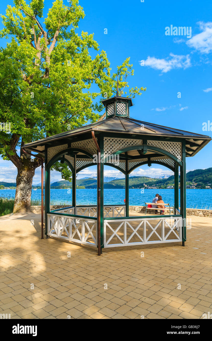 Summer house in park on shore of Worthersee lake on beautiful summer day, Austria Stock Photo