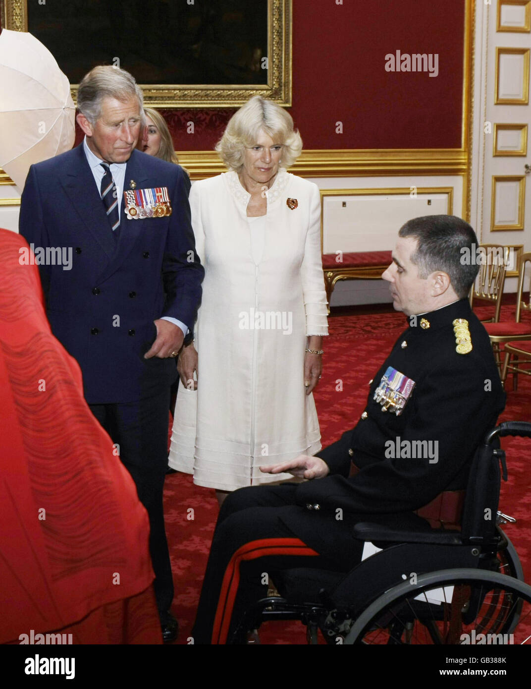 The Prince of Wales (left), and The Duchess of Cornwall (second left), meet George Cross holder Major Peter Norton during a reception for the Victoria Cross and George Cross Association reunion at St James's Palace State Apartments in London. Stock Photo