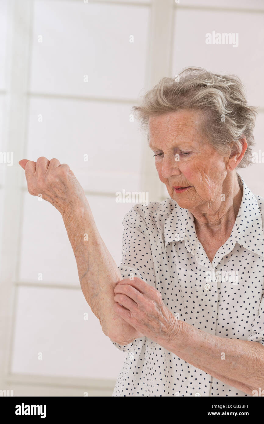 Itching In A old woman Stock Photo