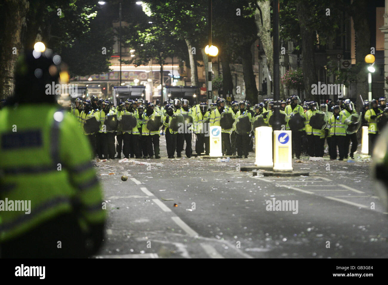 Police are seen in Ladbroke Grove, London, as trouble breaks out during