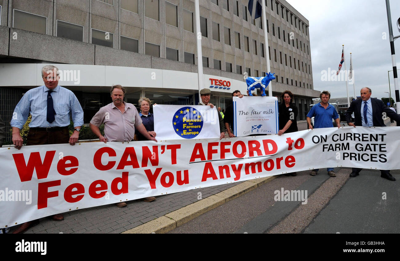 Dairy farmers and industry representatives, led by Farmers for Action, demonstrate outside the headquarters of supermarket giant Tesco, in Cheshunt, over the chain's milk price contract. Stock Photo