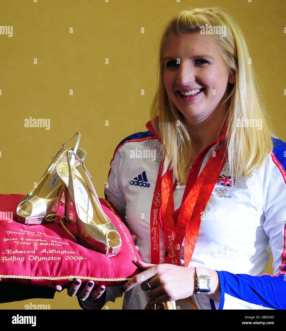 Double Gold medalist Rebecca Adlington receives a pair of gold Jimmy Choos before the open top bus parade in Mansfield. Stock Photo