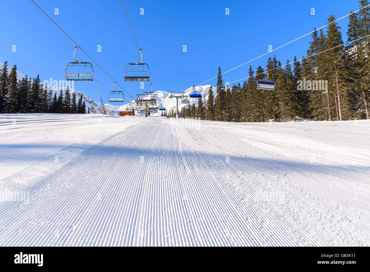 Freshly groomed ski slope in Rohace winter resort, Tatra Mountains, Slovakia Stock Photo