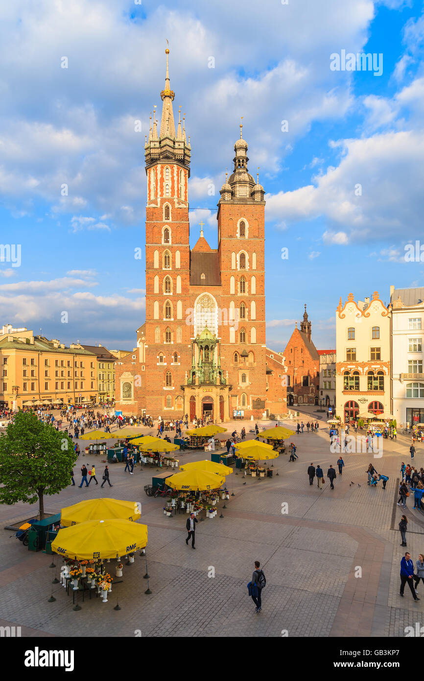 KRAKOW, POLAND - APR 29, 2015: Mariacki cathedral on main market square of Krakow city. More than 10 Million tourists visit the Stock Photo