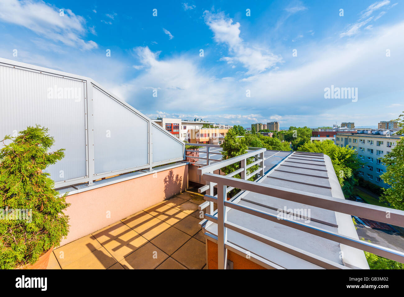 View of beautiful sky with white clouds from terrace of new city apartment in Krakow, Poland Stock Photo