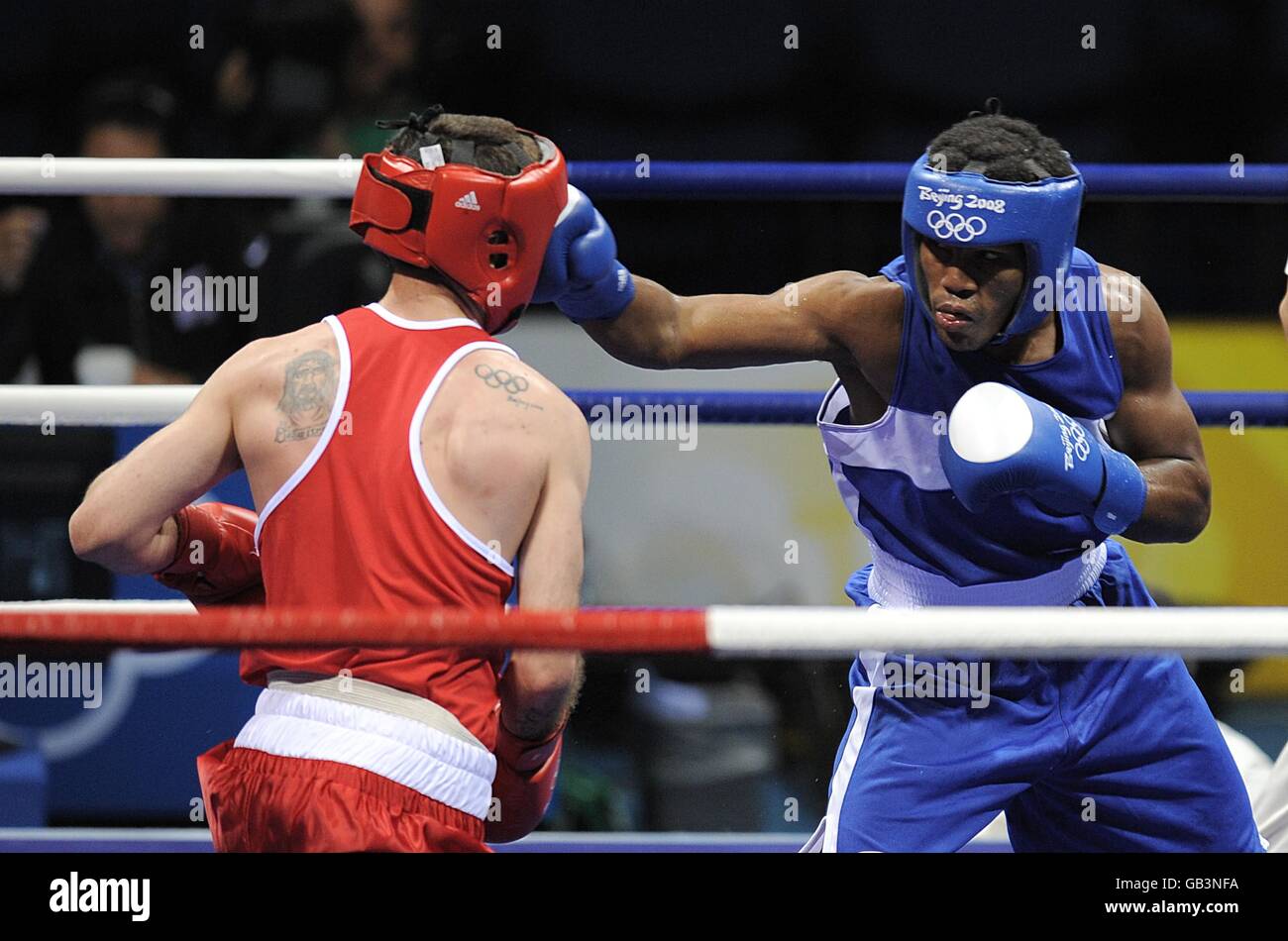 Ireland's Johnny Joyce (red) in action against Dominican Republic's Felix Diaz during their second round light welterweight bout at the Beijing Workers Gymnasium in Beijing, China. Stock Photo