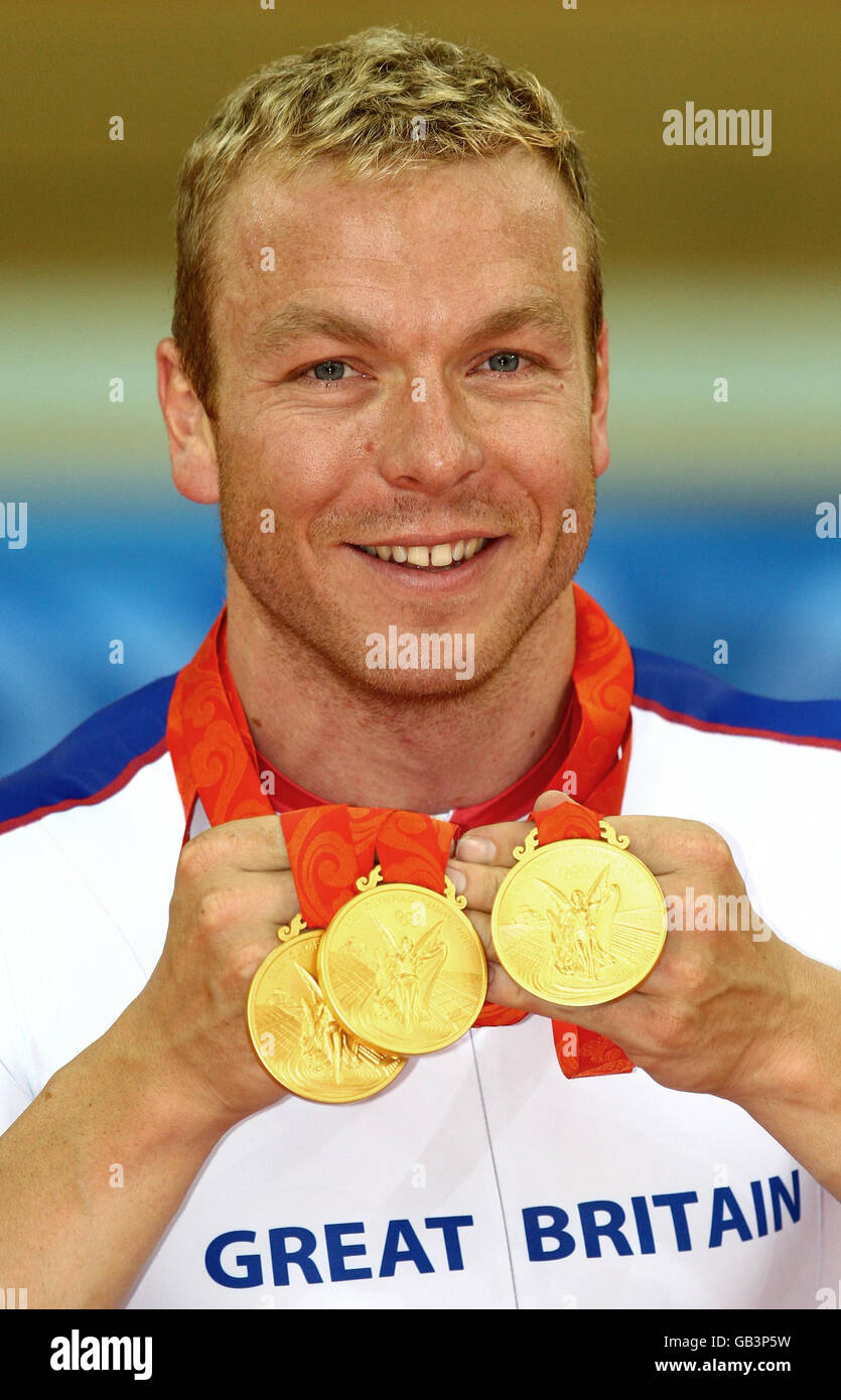 Great Britain's Chris Hoy with the three Gold Medals he won in Laoshan