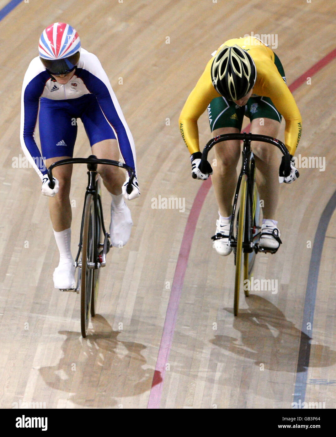 Great Britain's Victoria Pendleton (left) pedals for gold alongside Australia's Anna Meares during the Women's Sprint Final at the Laoshan Velodrome during the 2008 Beijing Olympic Games in China. Stock Photo