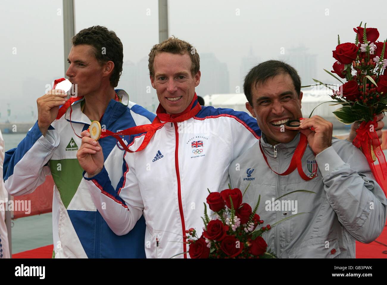 Britain's gold medalist Paul Goodison (center) is flanked by silver medalist Slovenia's Vasilij Zbogar (left) and bronze medalist Italy's Diego Romero Stock Photo