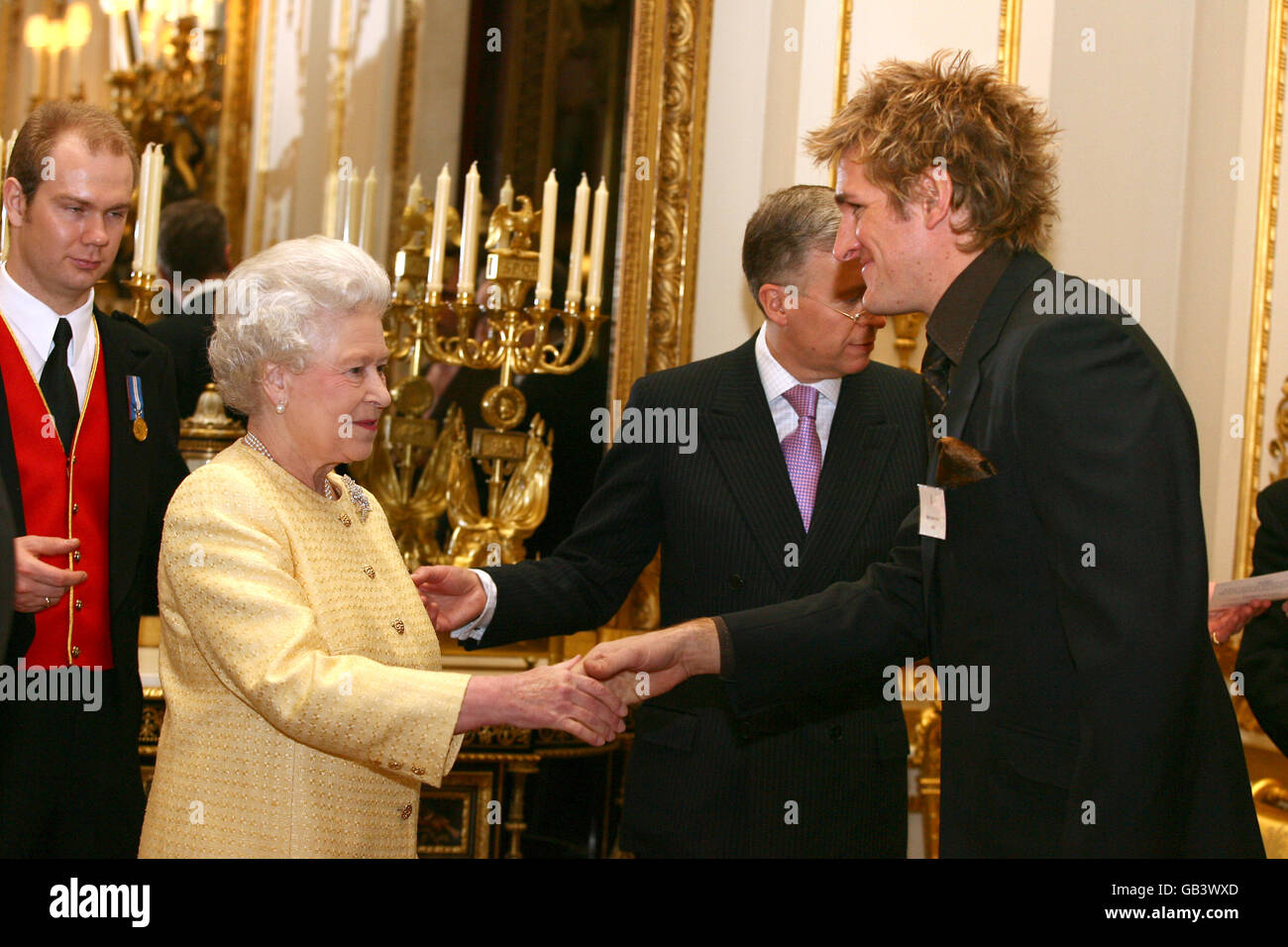 The Queen chats to Curtis Stone, Australian TV chef, during a recepton for 'Prominent Australians' at Buckingham Palace, in central London. The reception was held ahead Her Majesty's visit to Australia for the Commonwealth Games. Stock Photo
