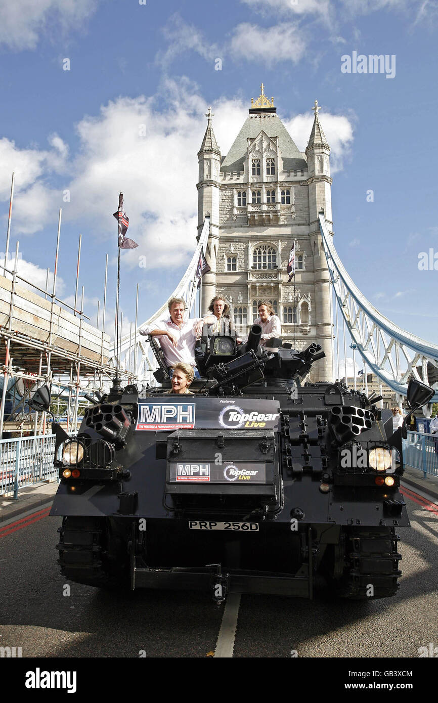 Top Gear presenters, (l-r) Jeremy James May and Richard Hammond, are driven across Tower Bridge in a stretched (two welded together) 434 Armoured Personel Carrier, to a press conference in