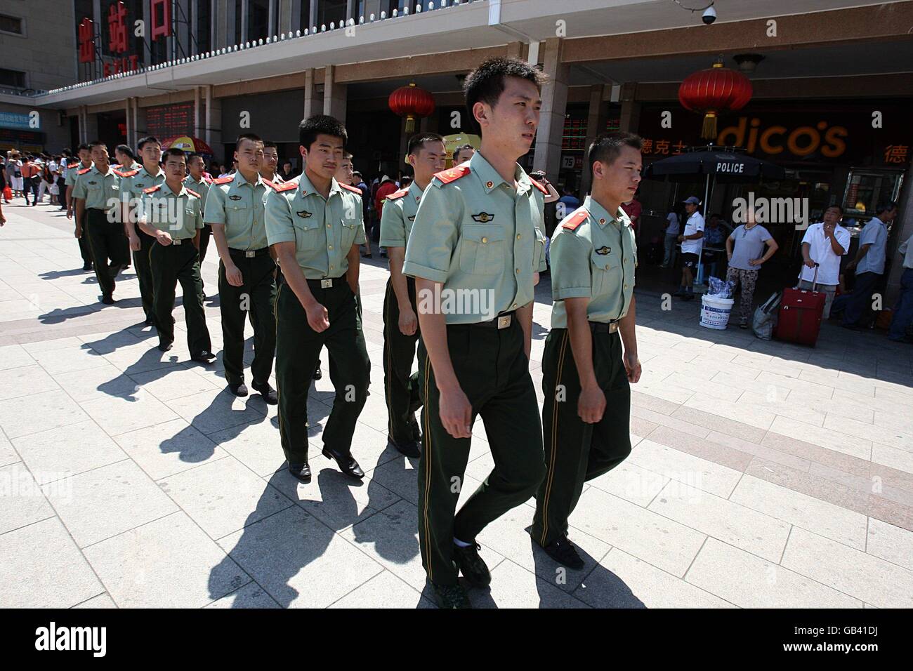 Chinese paramilitary soldiers march outside the railway station prior to the 2008 Olympic Games in Beijing, China. Stock Photo