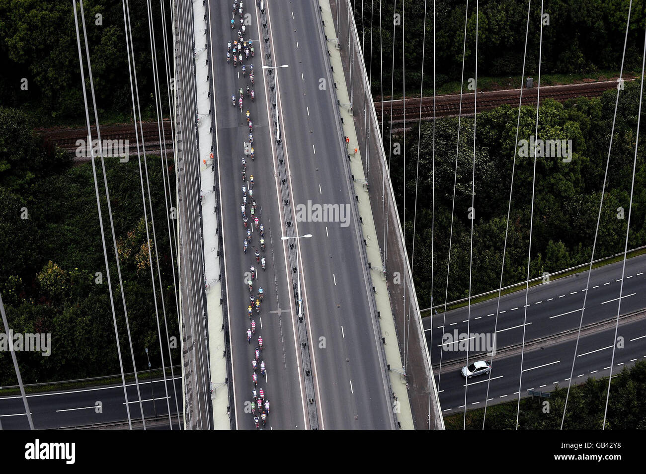 Riders cross the Humber Bridge during stage five of the Tour of Britain cycle race. Stock Photo