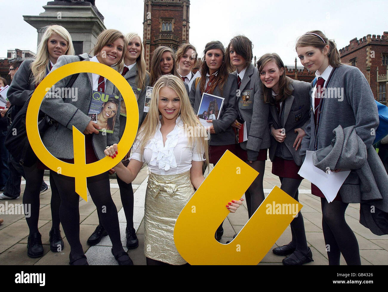Queen's graduate Zoe Salmon pictured at the university with students from Victoria College, Belfast, to help launch an open day and QU, a publication for prospective students. Stock Photo