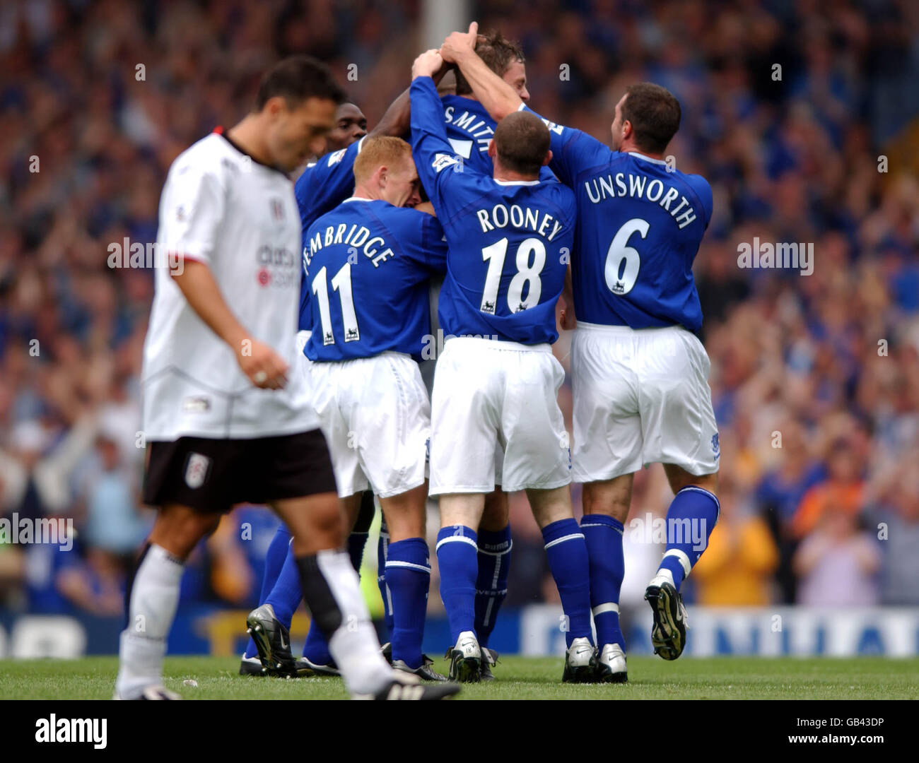 A dejected Steed Malbranque of Fulham as Everton celebrate the first goal scored by Gary Naysmith Stock Photo