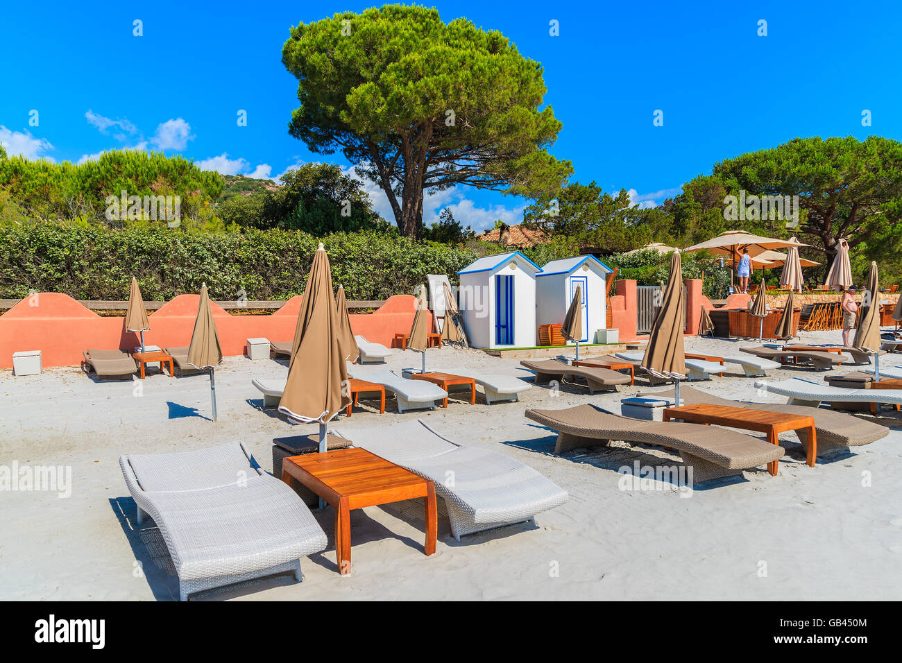 Sunbeds on Palombaggia beach on sunny summer day, Corsica island, France Stock Photo