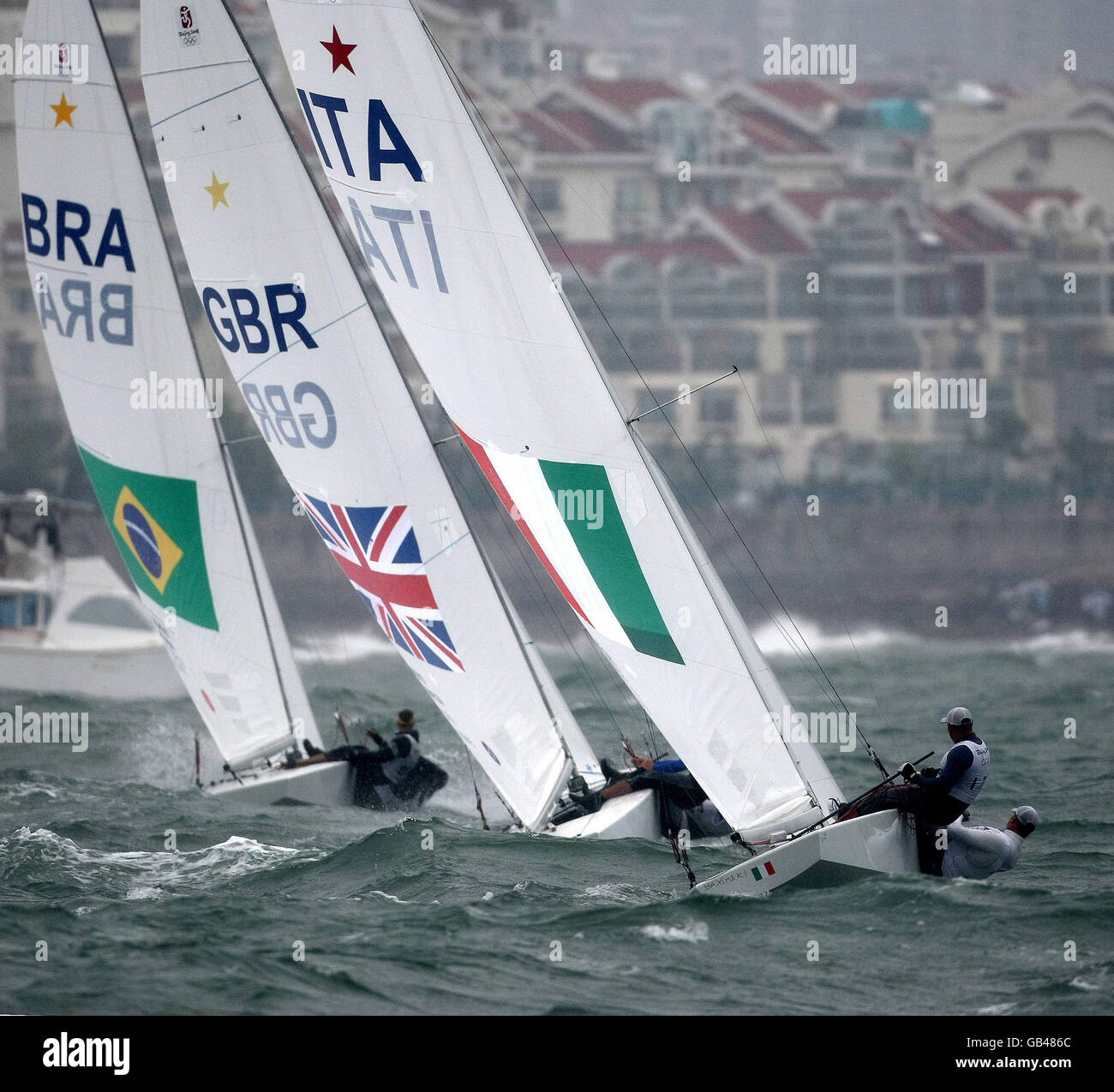 Star crews from Brazil, Great Britain and Italy head upwind during the final round of their Beijing Olympic competition off Qingdao, China Stock Photo