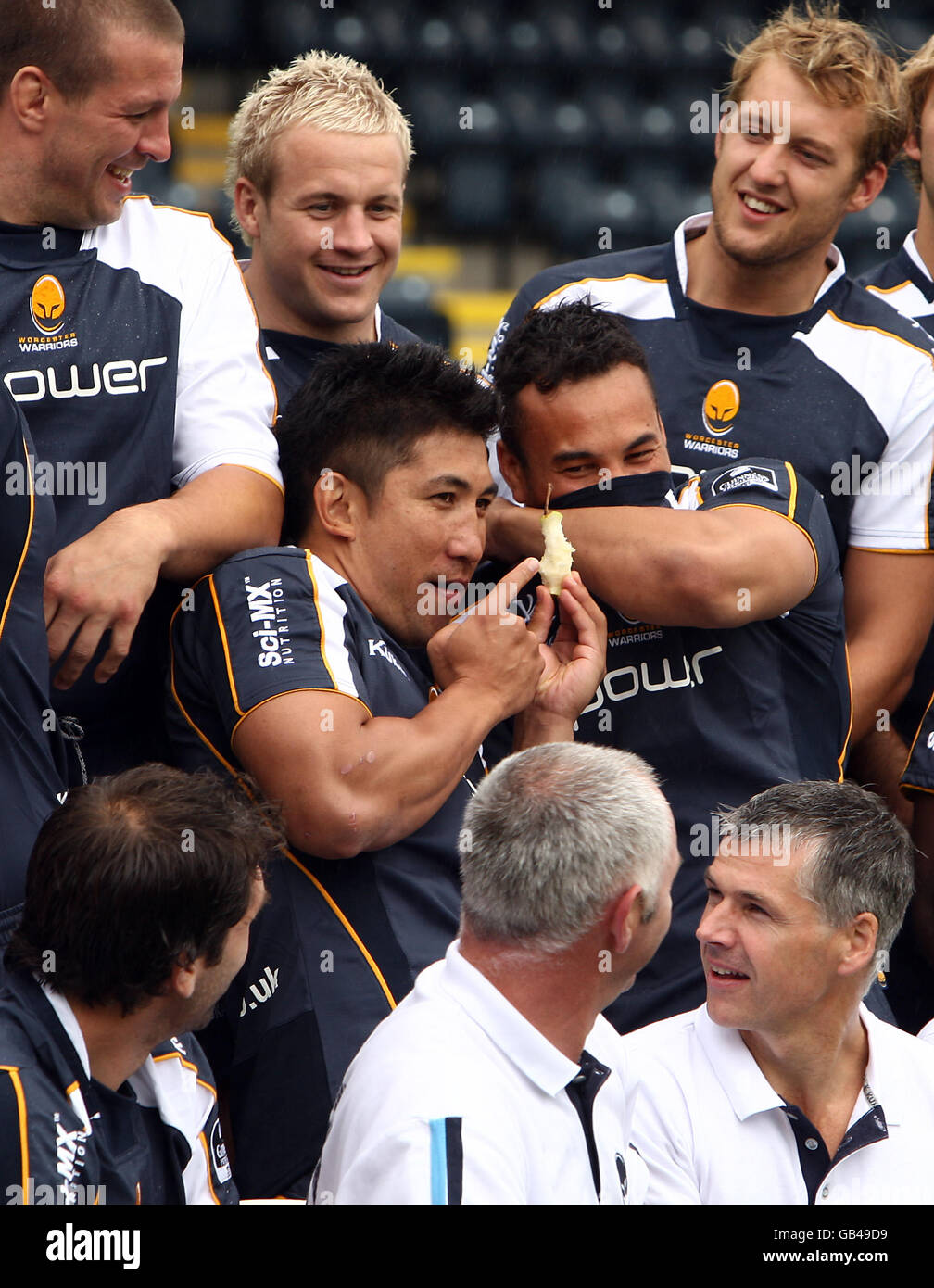 Worcester Warriors' Loki Crichton breaks the tension of the team group photcall with a Pear core Stock Photo
