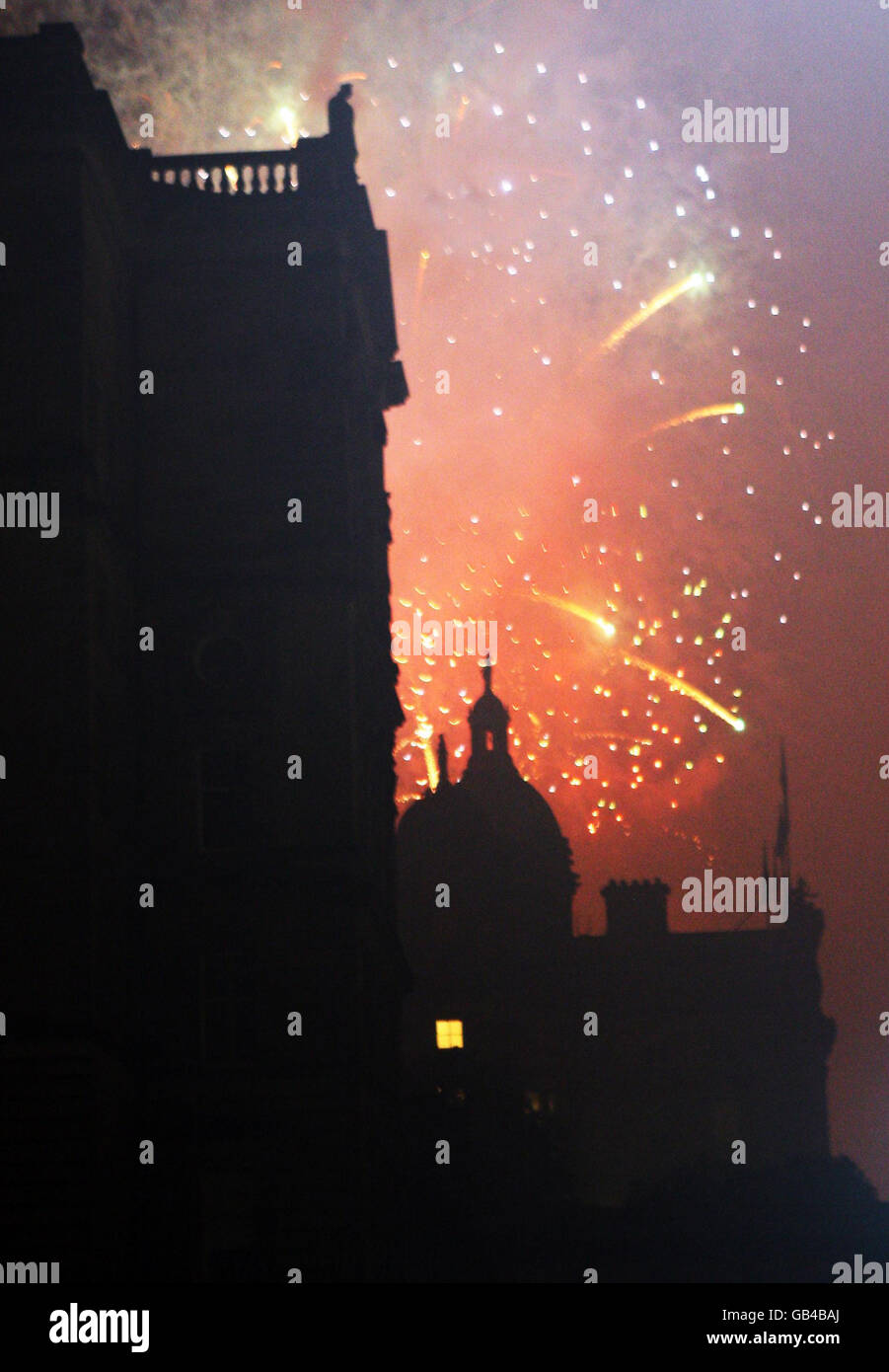 Edinburgh celebrates the end of the Edinburgh International Festival with fireworks concert music performed live by the Scottish Chamber Orchestra, with a choreographed firework display. Stock Photo