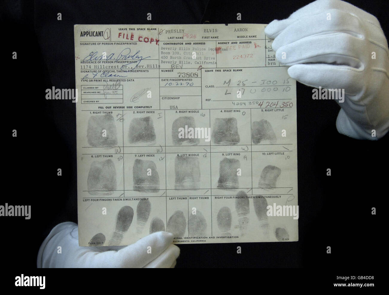 Elvis Presley's Concealed Weapon application which has Elvis's fingerprints on it, at London's Idea Generation Gallery. Stock Photo