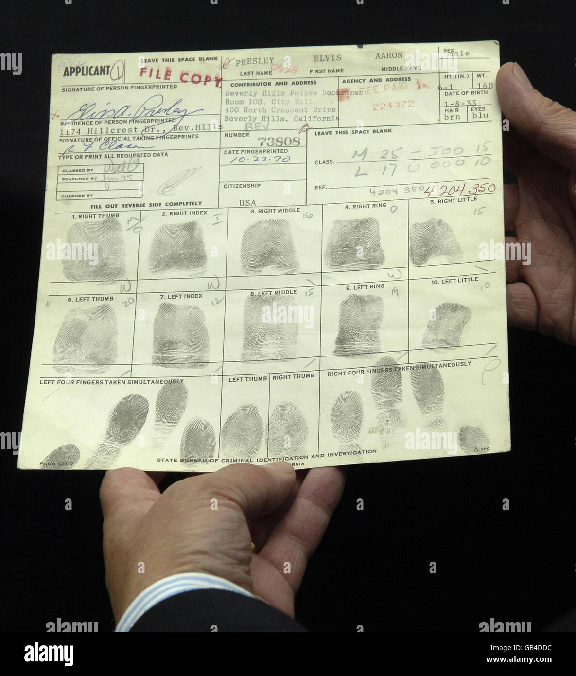 Elvis Presley's Concealed Weapon application which has Elvis's fingerprints on it, at London's Idea Generation Gallery. Stock Photo