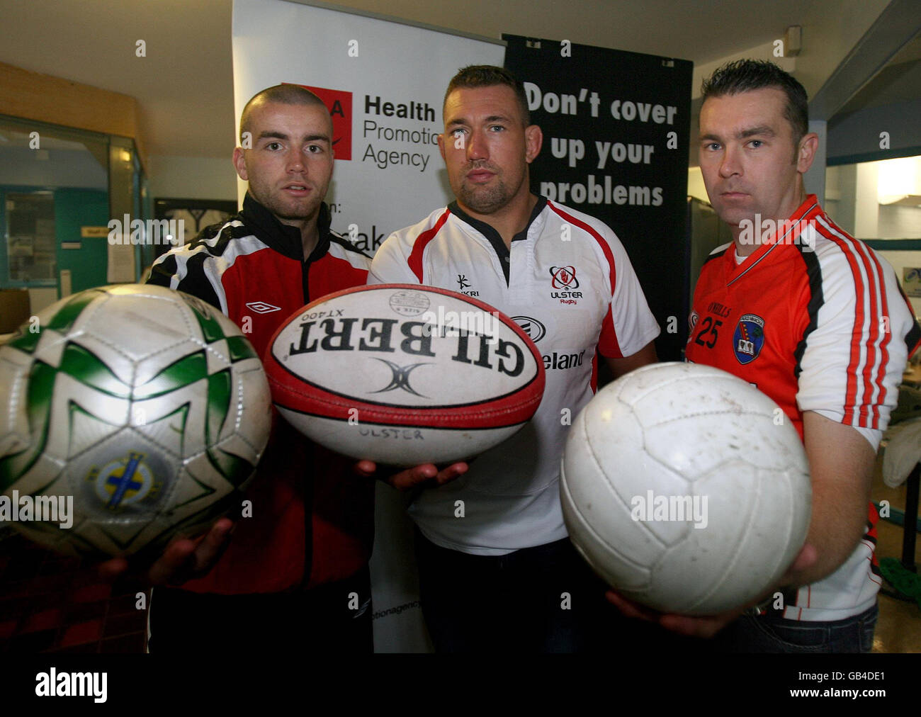 Ulster sportsmen (left to right) Crusaders' Colin Coates, Ulster Rugby's Justin Fitzpatrick and Armagh's Oisin McConville, at the launch of a health campaign aimed at young men in Belfast. Stock Photo