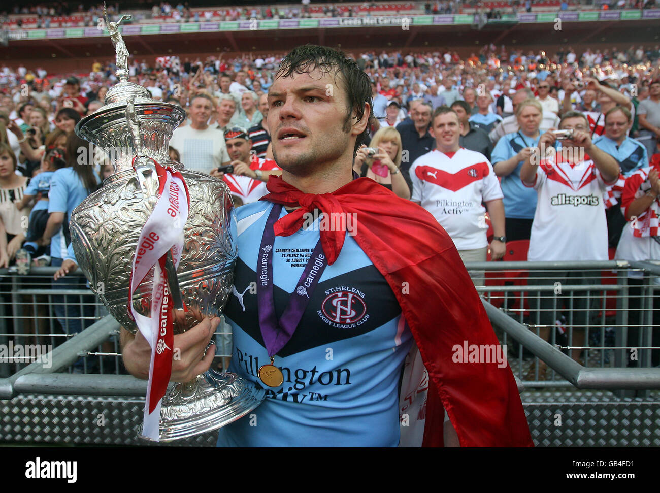 St Helens' Keiron Cunningham celebrates with the trophy following the