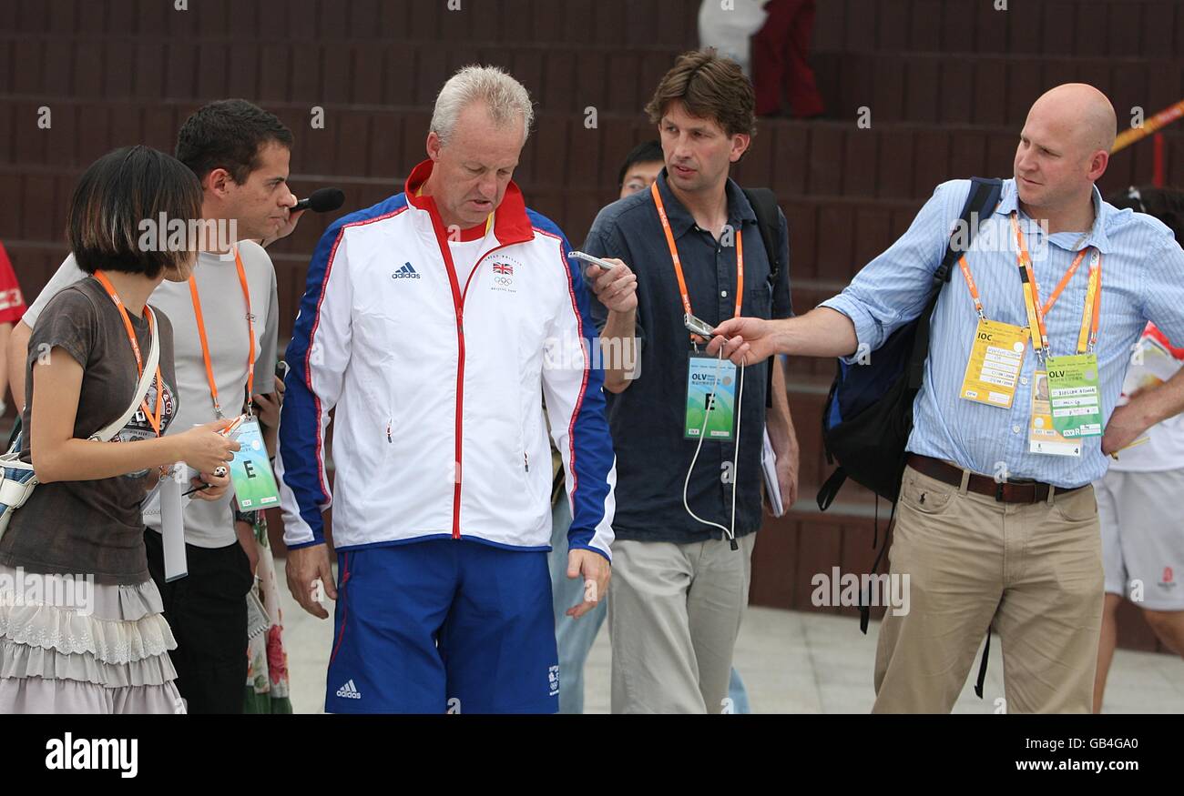 Great Britain's Chef de Mission Simon Clegg is questioned by the media following the Great Britain flag raising ceremony at the Olympic Village in Beijing, China. Stock Photo