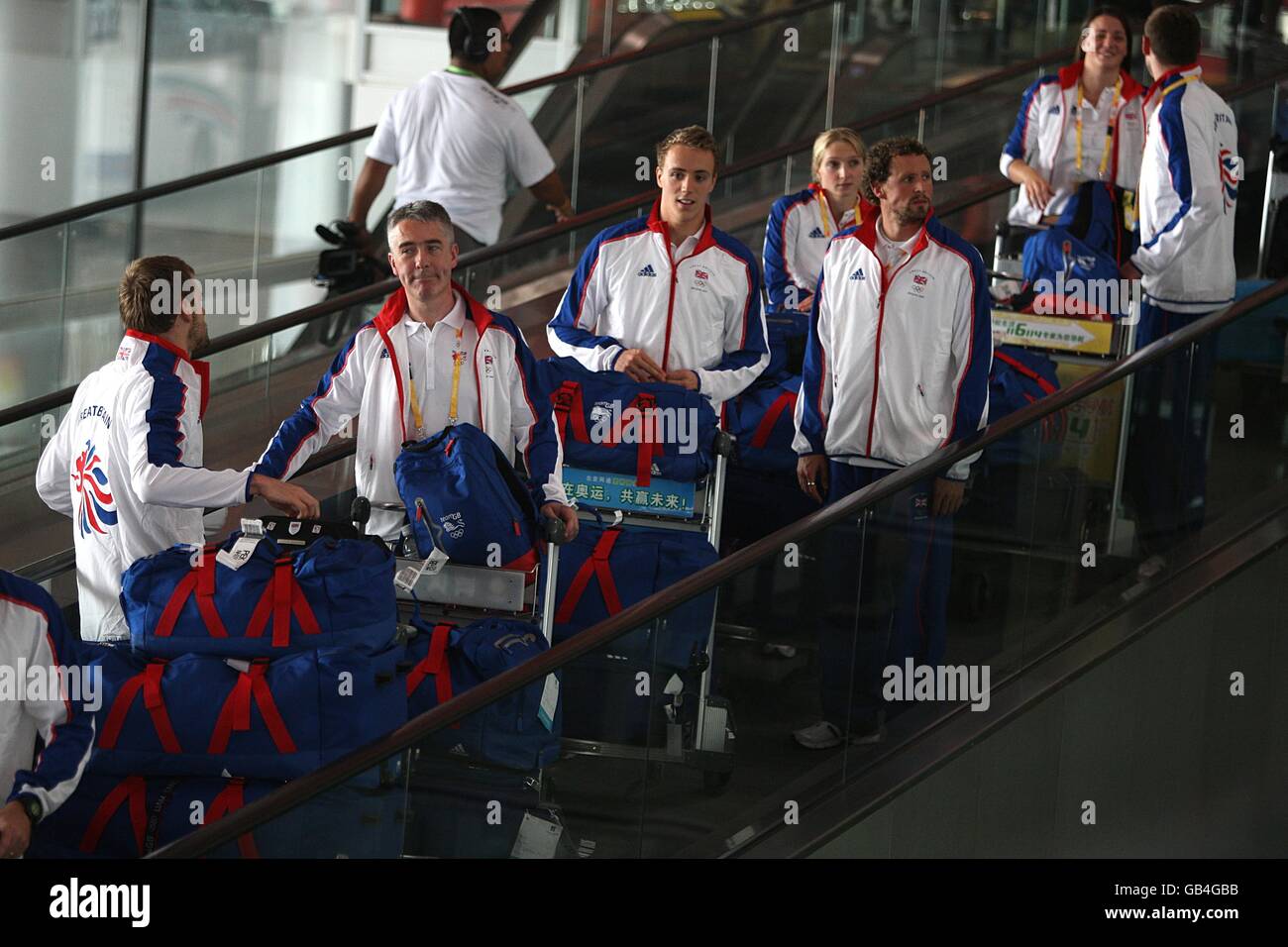 Some of the Great Britain Olympic team make their way through the terminal after arriving at Beijing airport as preparations continue for the start of the 2008 Beijing Olympic Games. Stock Photo