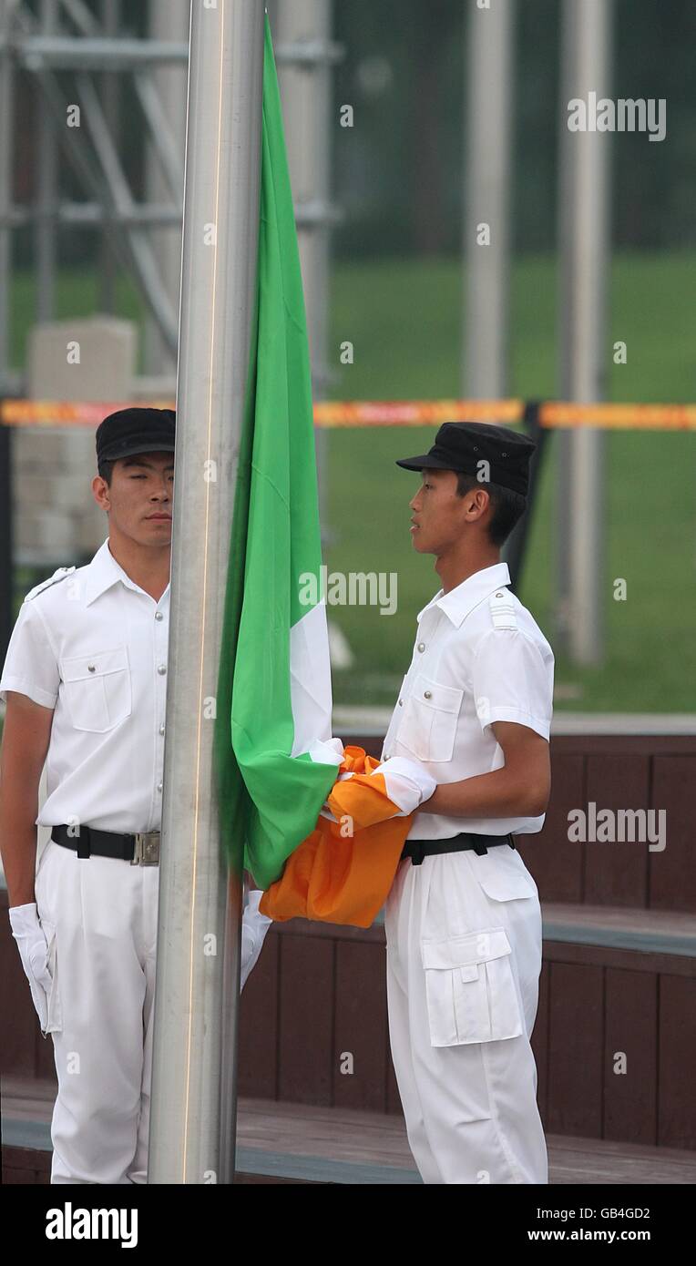 Chinese officials raise Ireland's national flag during their flag
