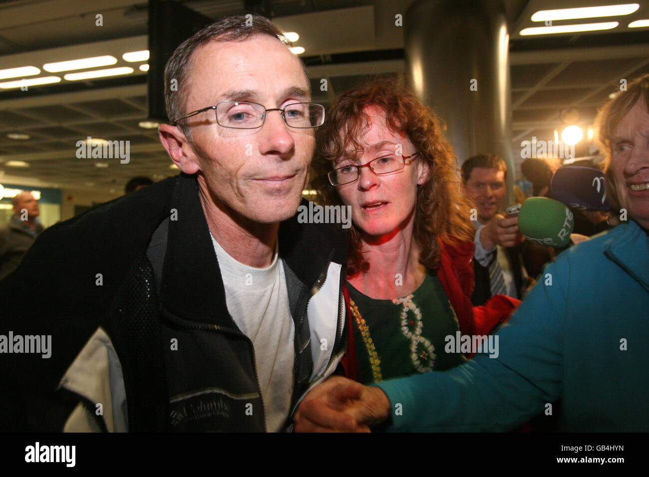 Dubliners Oisin and Liz Neary, who were among twenty trainees and five crew were rescued from life rafts by the French coastguard after the Asgard II went down 20 nautical miles off the coast of France in the Bay of Biscay, arrive back at Dublin airport. Stock Photo