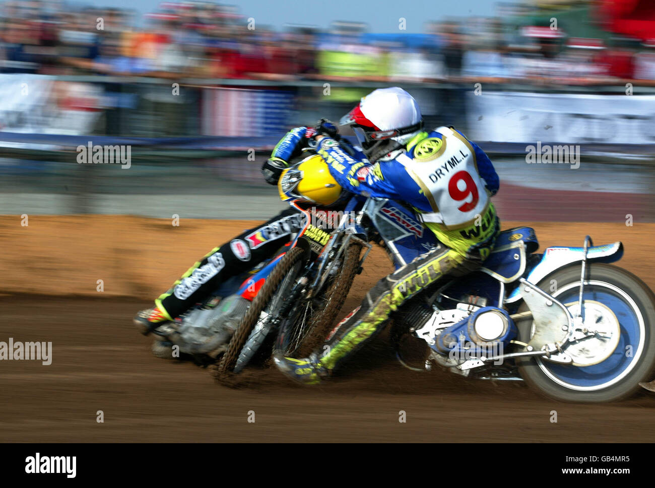 Speedway - Grand Prix Qualification - Final. Peter Karlsson (yellow hat) and Lukas Dryml (white hat) collide on the first bend in the 3rd heat Stock Photo