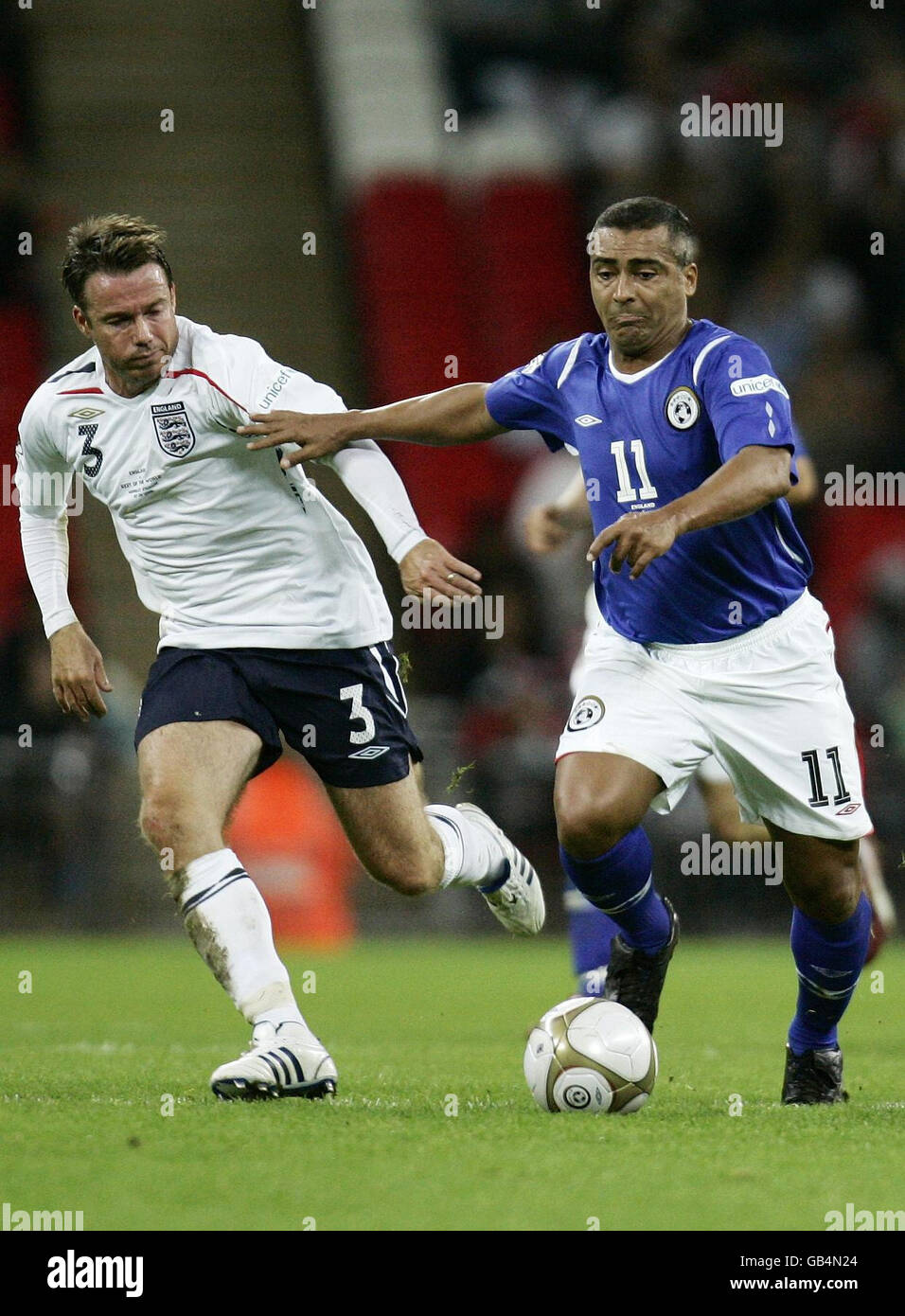 Romario (right) and Graeme Le Saux fight for possession during the Soccer Aid 2008 charity soccer match at Wembley Stadium, London. Stock Photo