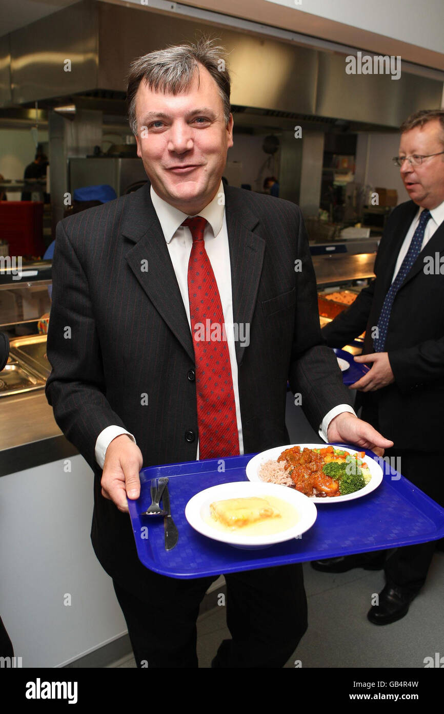 Schools secretary Ed Balls, tries a school meal during a visit to Kelmscott School, Walthamstow north London as he joined fellow ministers to open 30 new schools across the country this morning. Stock Photo